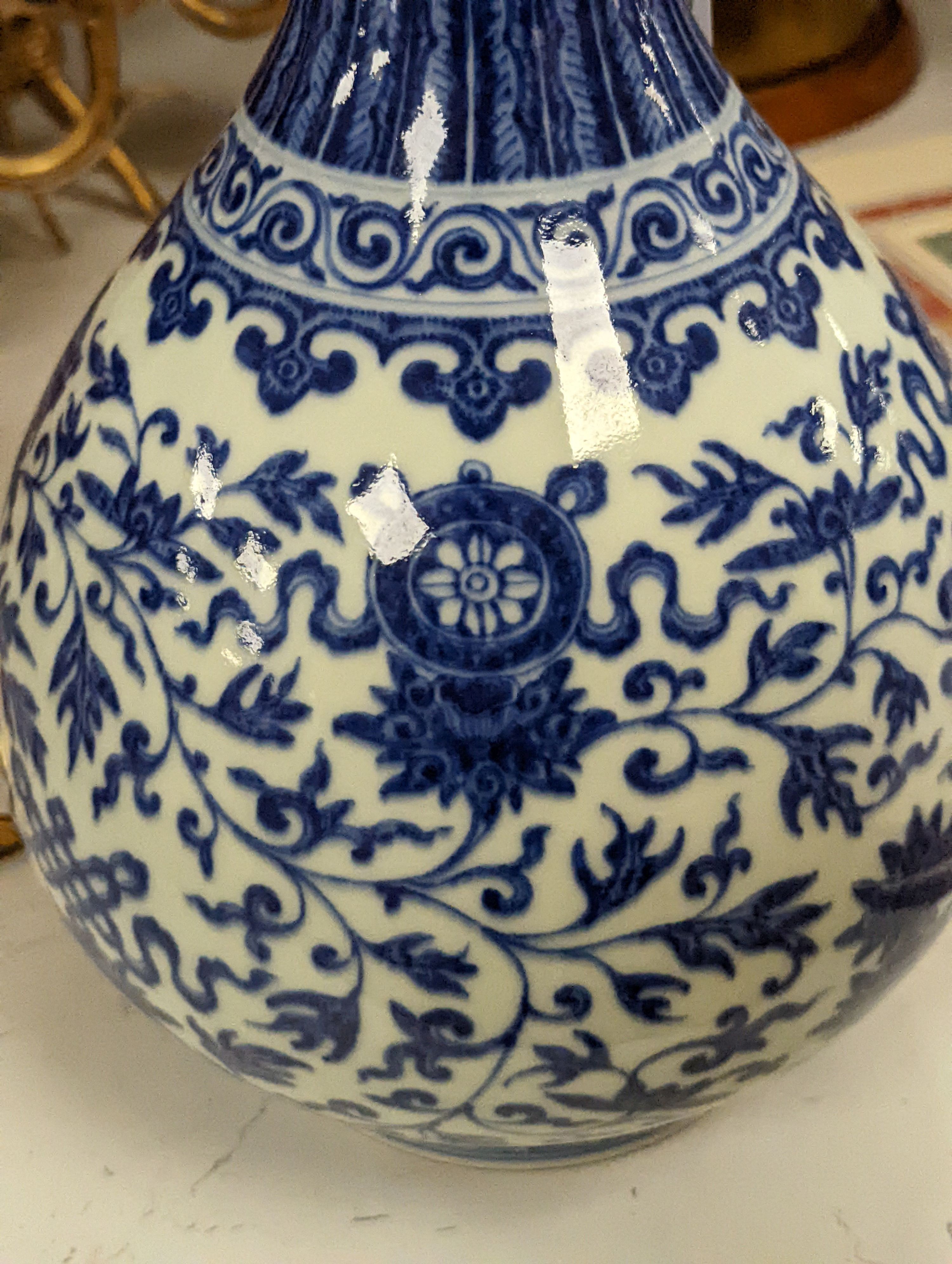 A Chinese blue and white Ming style 'lotus' vase, Yuhuchunping, Qianlong seal mark but 19th century - 28cm high